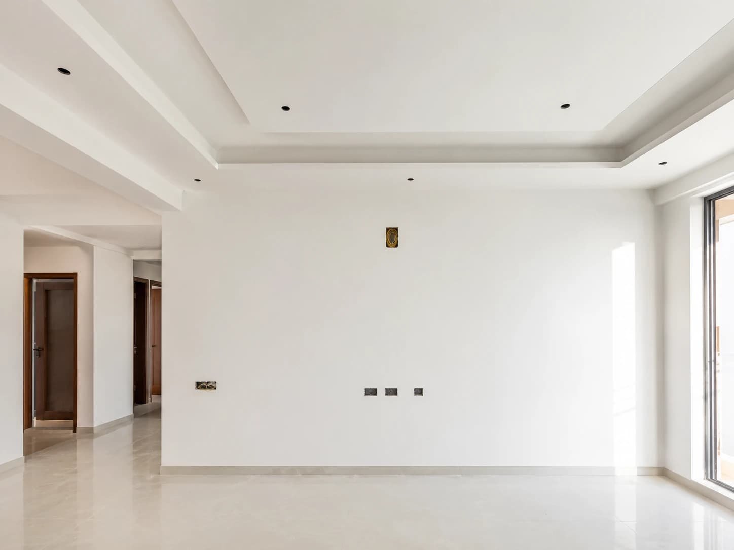Smooth white wall after professional wall putty application in Attapur Hyderabad